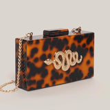 Luara Tortoiseshell Metal Snake Accent Clutch