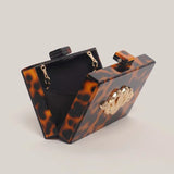 Luara Tortoiseshell Metal Snake Accent Clutch