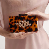 Luara Tortoiseshell Metal Snake Accent Clutch