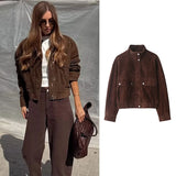 A woman wearing a dark brown suede jacket over a white top and brown wide-leg pants, holding a brown woven bag, shown beside a clean product-only view of the same jacket on a white background.