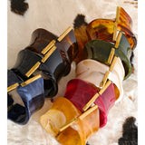 Cara Resin Twist-Fold Statement Bangle