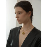 Gold Spiral Medallion Pendant Necklace