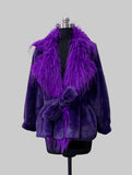 A purple faux fur belted jacket with a large matching purple feather collar, displayed on a black mannequin torso against a solid gray background.